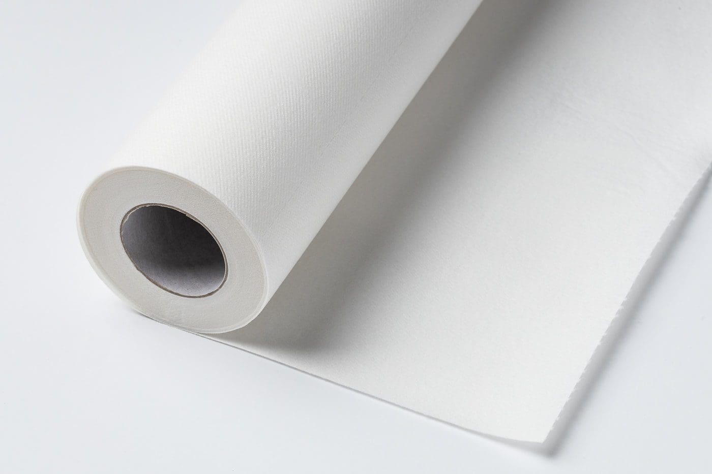 A roll of white paper with a smooth surface.