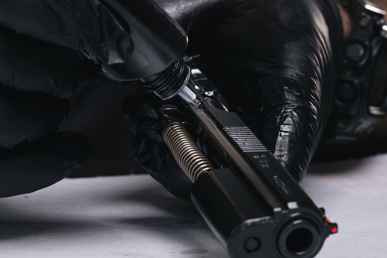Applying RifleCX CLP Oil to the firearm action