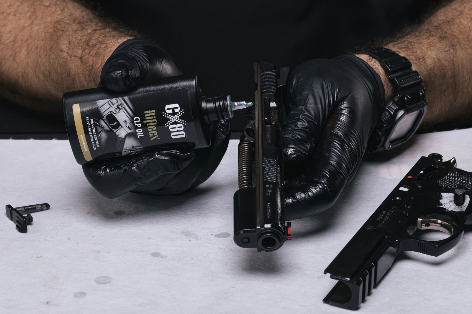 Lubricating the firearm slide with RifleCX CLP Oil